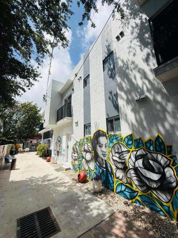 Mural on the side of the Atrium guest house building in Miami